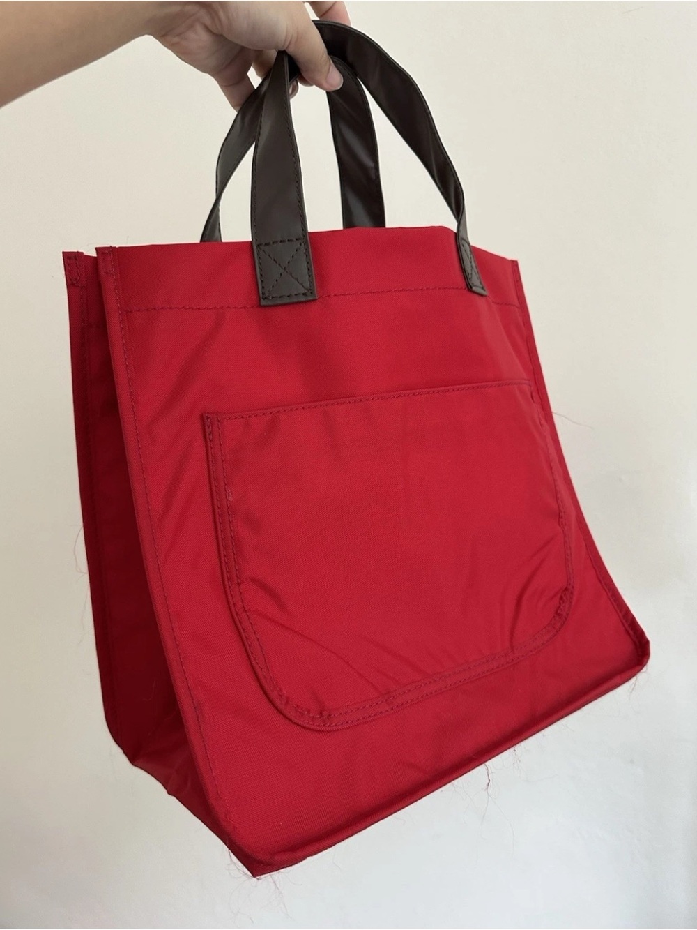 Authentic Tricot Comme Des Garçons. Red Nylon. White Canvas lining. Used once.